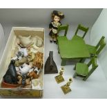 A collection of ceramic farmyard animals, a costume doll,