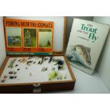 A box of fishing flies and two fishing books,