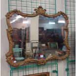 A gilt framed mirror