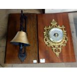 A mounted bell and aneroid barometer