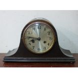 An oak mantel clock