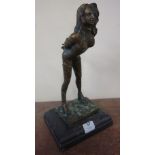 A bronze figure of an erotic figure