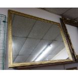 A gilt framed mirror