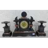A 19th Century French Belge noir and rouge marble clock garniture