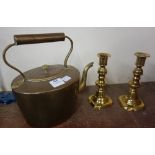 A Victorian brass kettle and a pair of brass candlesticks