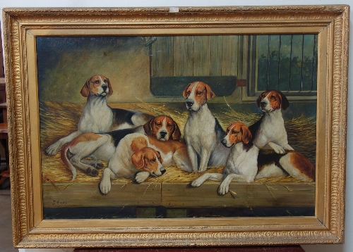 Manner of John Emms (1843-1912), six fox hounds in a barn, oil on canvas, signed lower left,