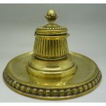 A Victorian brass inkwell