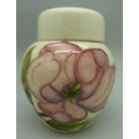 A Moorcroft magnolia ginger jar, height 11.