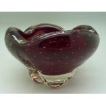 A Whitefriars ruby red lobed molar bowl with encased bubbles, designed by Geoffrey Baxter,