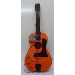 A Beatles Big 6 plastic guitar,