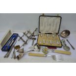 A silver bladed mother of pearl handled fruit knife, candle snuffer, military badges, etc.