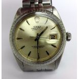 A gentleman's stainless steel cased Rolex Oyster Perpetual Datejust wristwatch on a stainless steel