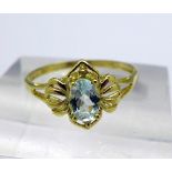 A 9ct gold and blue topaz ring, weight 1g,