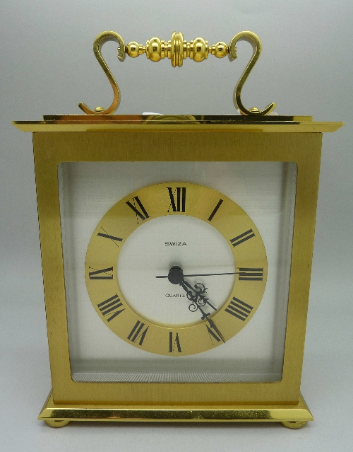 A Swiza brass cased mantel clock with quartz movement