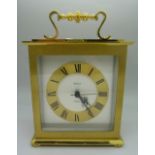 A Swiza brass cased mantel clock with quartz movement