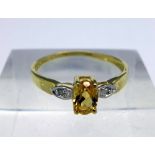 A 9ct gold, citrine and diamond ring, weight 1.