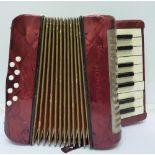 A small Hohner eight button accordion