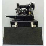 A Singer electric sewing machine,