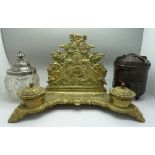 A brass desk stand with two inkwells,