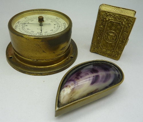 A brass snuff box in the form of a mussel shell,