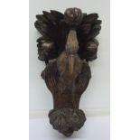 A carved Black Forest wall bracket in the form of a bird, a/f,