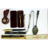 A pair of Victorian scissors, a faux tortoiseshell fan and plated items, pens, etc.