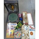 A wind-up Decca gramophone, children's toys including a Tri-ang trumpet, boxed, board games, etc.