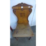 A Victorian oak hall chair