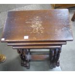 An oak nest of three tables