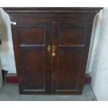 A George III oak cupboard