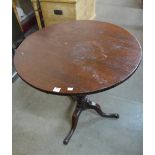 A George III oak circular tilt-top tripod table