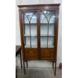 An Edward VII inlaid mahogany display cabinet