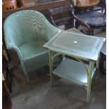 A Lloyd Loom armchair and occasional table