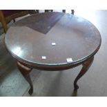 An oval mahogany occasional table