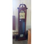 A reproduction mahogany longcase clock