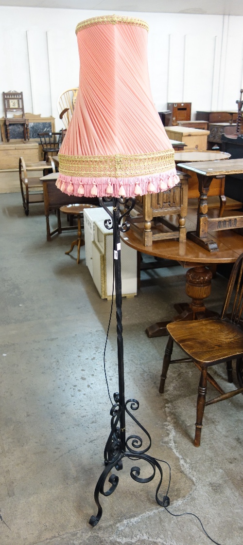 A wrought iron standard lamp