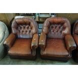 A three seater leather sofa and two armchairs