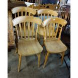 A set of four Victorian style beech slat back chairs