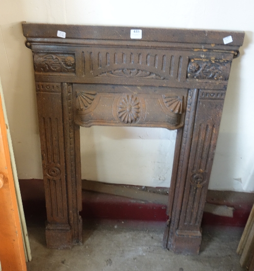 A cast iron bedroom fireplace