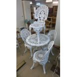 A Victorian style cast metal garden table and four chairs