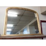 A gilt framed overmantel mirror