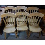 A set of six reproduction farmhouse style slat-back kitchen chairs