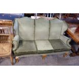 An upholstered wingback sofa