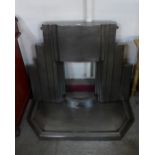 An Art Deco style Jig stainless steel fire surround and hearth