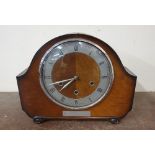 A mahogany mantel clock