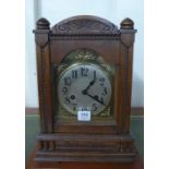 An early 20th Century continental oak mantel clock