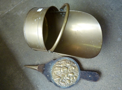 A brass coal scuttle and fire bellows