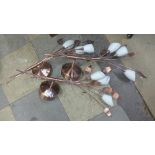 A set of three copper effect wall lights