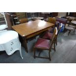 An Art Deco walnut five piece dining suite