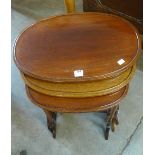 An Edward VII mahogany oval nest of tables